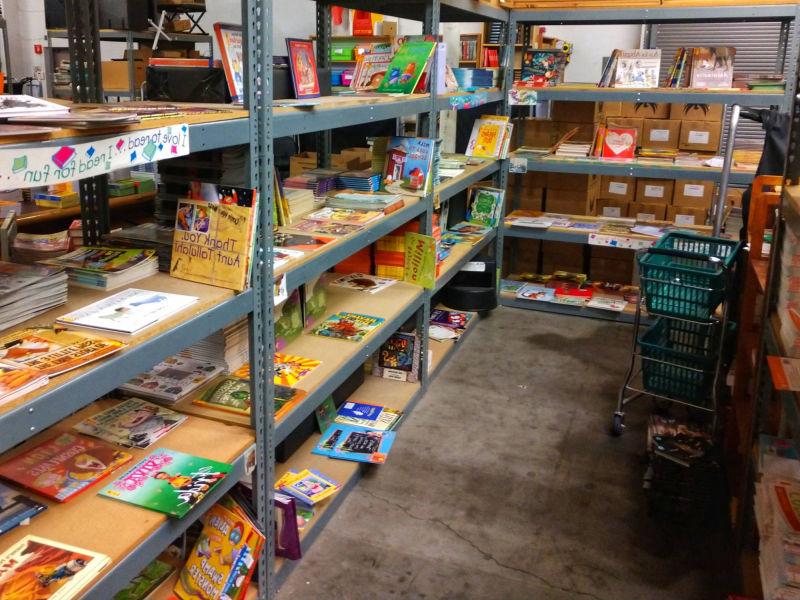 L shaped row of shelves with picture books